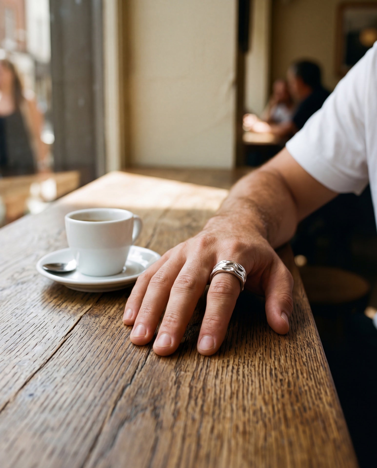 Aurean Cloak worn at a cafe table